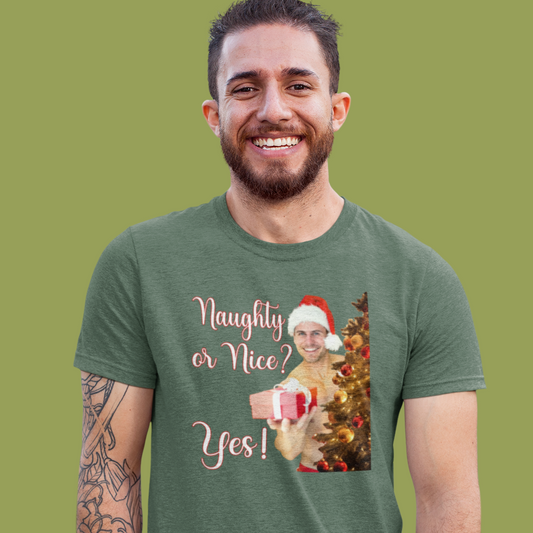 Man wearing a green t-shirt with a Christmas-themed graphic and text on a green background