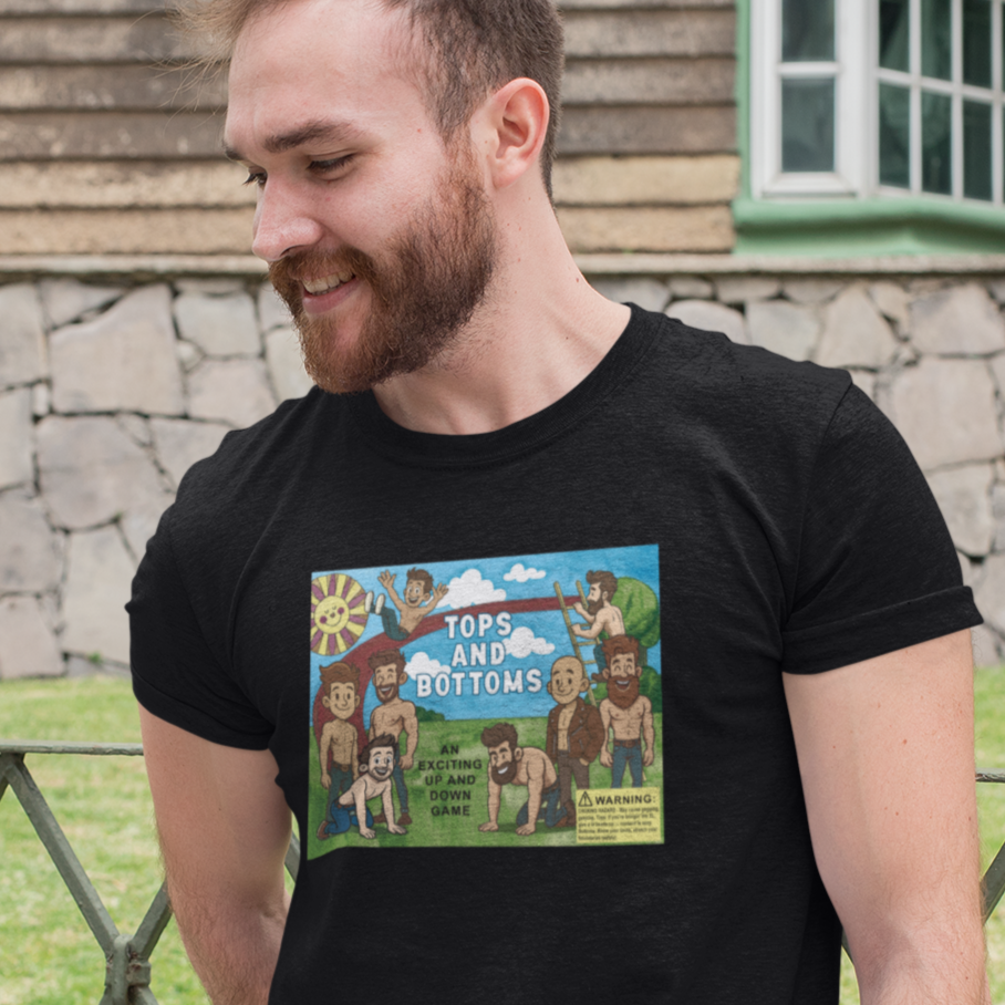 Man wearing a black t-shirt with a graphic design standing outdoors.