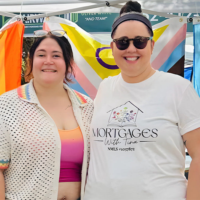 Two people standing in front of a colorful banner with Mortgages with Tina  and pride flags.